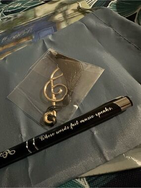 Black pen with written “Where words fail music speaks.”